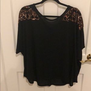 Black shirt with sequin butterfly on shoulders